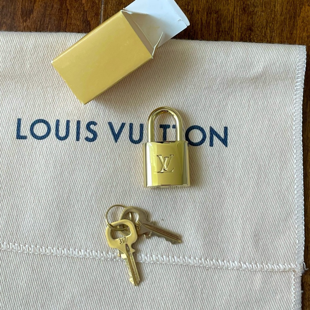 ** SOLD ** Brand new Louis Vuitton padlock and 2-key set